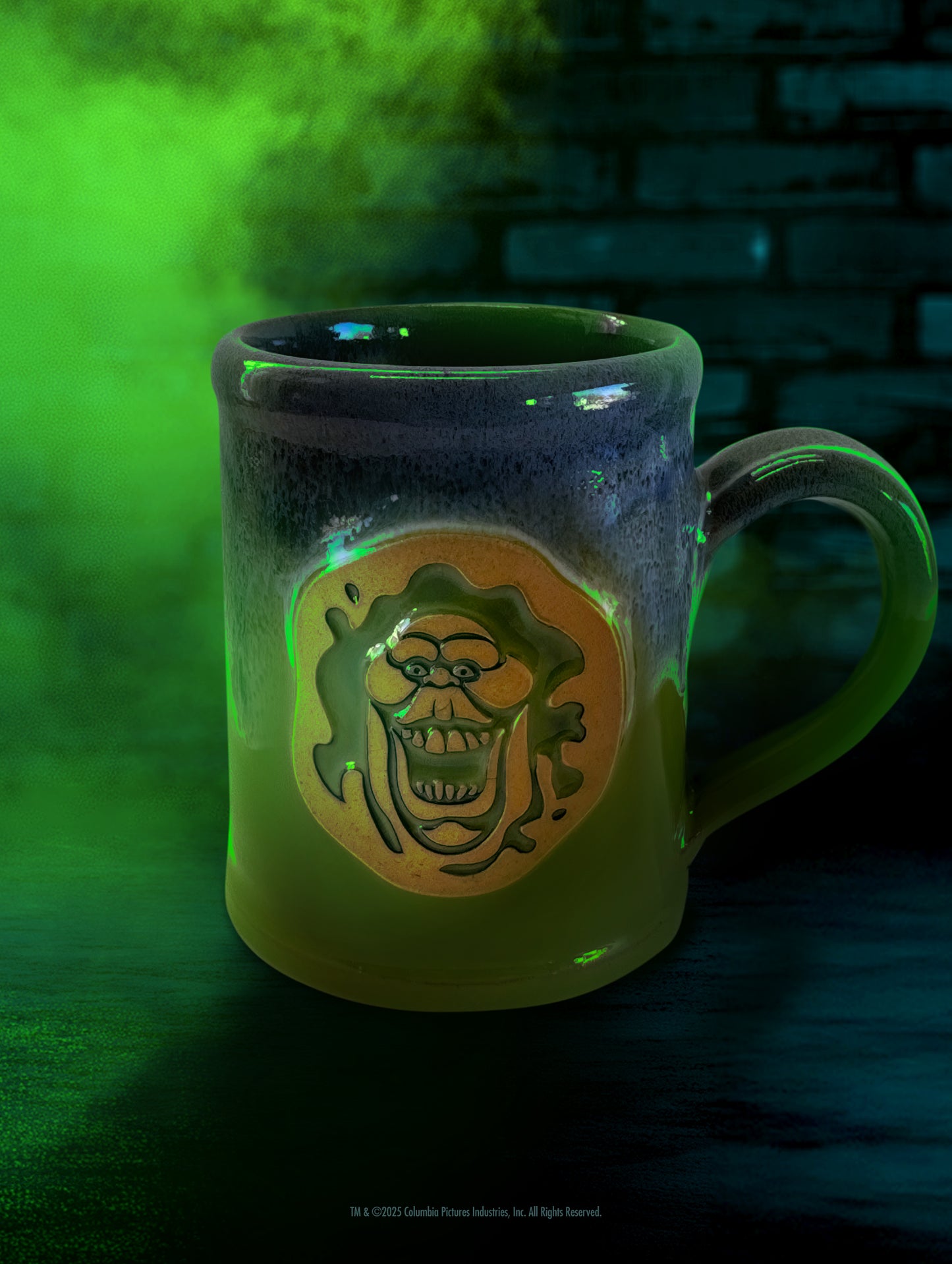 The official Ghostbusters Slimer handthrown mug by Deneen Pottery, featuring a gooey green glaze.