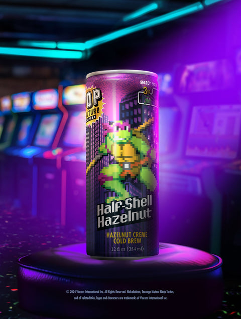  A close-up of a single can showing the retro arcade-style artwork of Donatello with his bo staff.