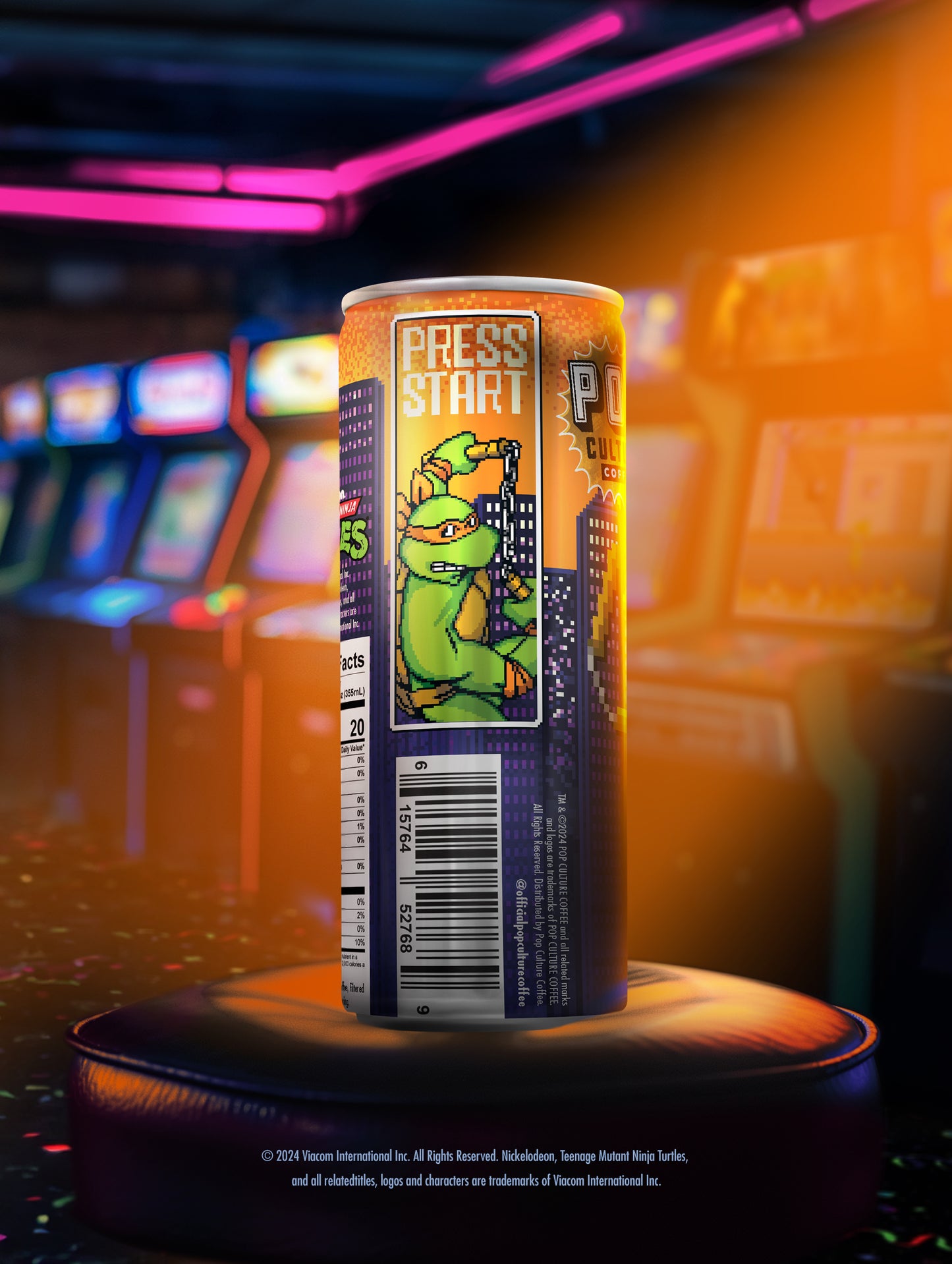 A close-up of a single can showing the retro arcade-style artwork of Michelangelo swinging his nunchucks.