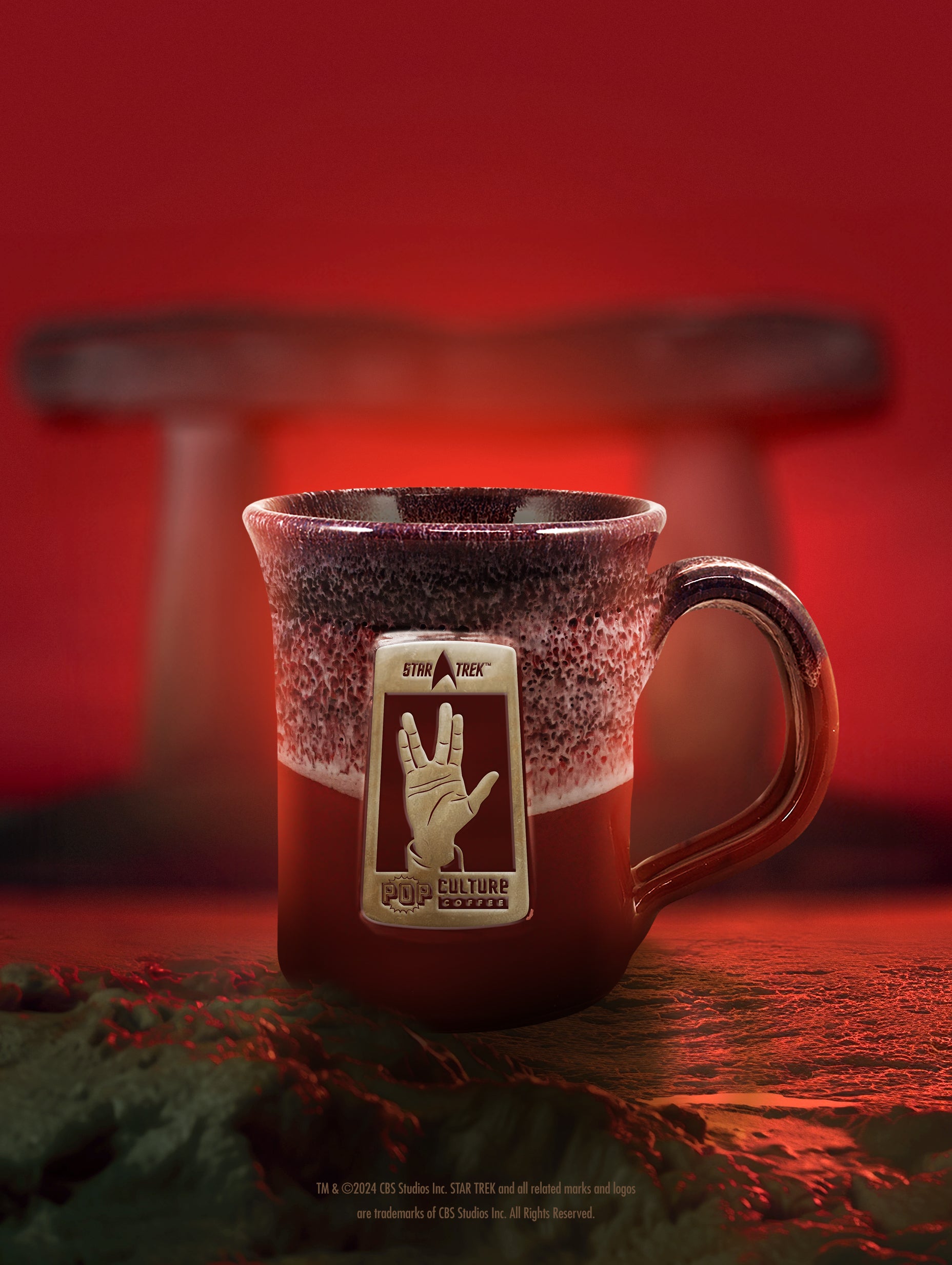 The Star Trek Vulcan Salute handthrown mug, featuring a striking red marble glaze.