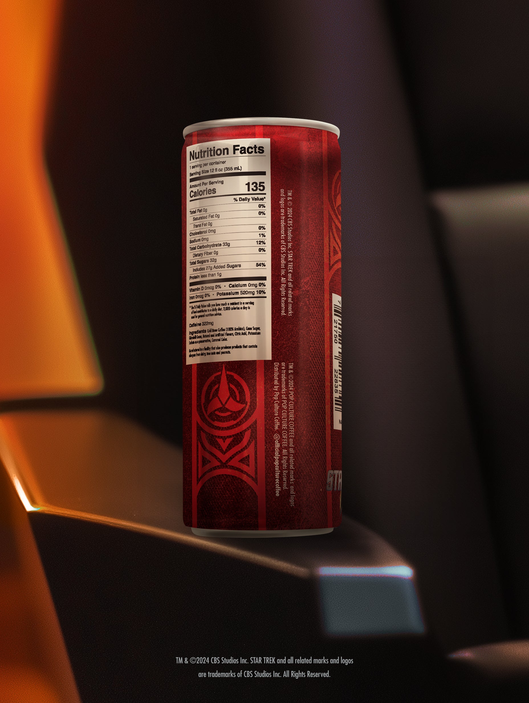 A close-up of a single can of Klingon Raktajino cold brew, showing the detailed Klingon-themed artwork by Jim Titus.