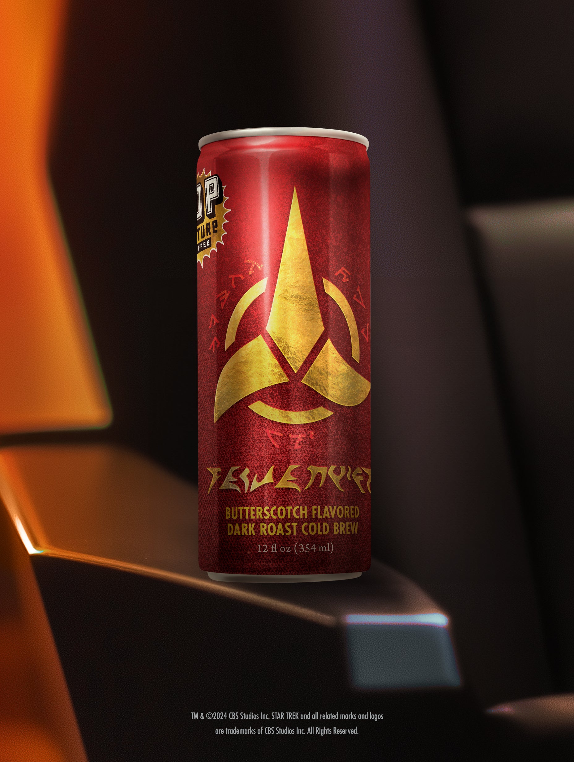 A close-up of a single can of Klingon Raktajino cold brew, showing the detailed Klingon-themed artwork by Jim Titus.