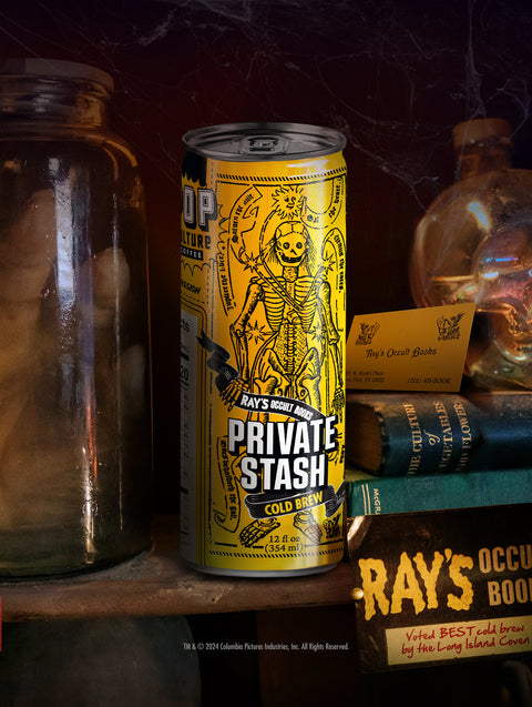 A close-up of a single can of Ray's Occult Private Stash cold brew, showing the detailed artwork inspired by Ray Stantz's bookstore.