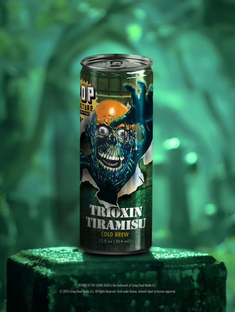 A close-up of a single can of Trioxin Taramisu cold brew, showing the detailed artwork of the Tar Man emerging from a barrel.
