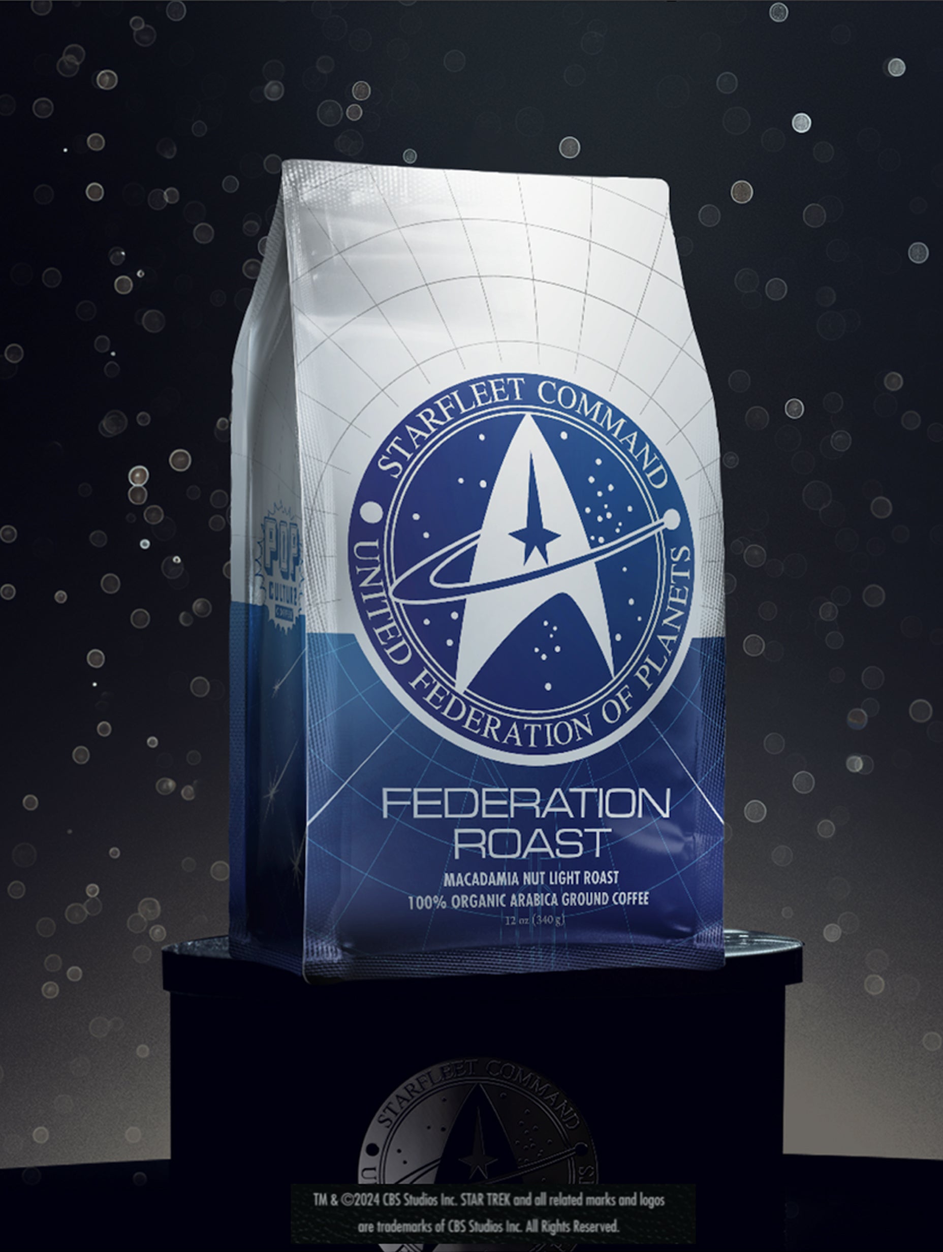 A package of Star Trek Federation Roast Macadamia Nut Coffee with a blue and white color scheme and Starfleet logo.