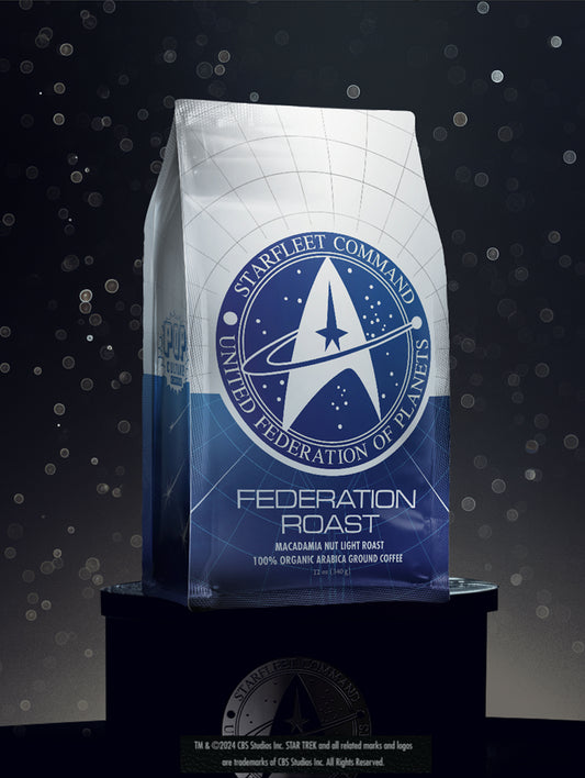 A package of Star Trek Federation Roast Macadamia Nut Coffee with a blue and white color scheme and Starfleet logo.